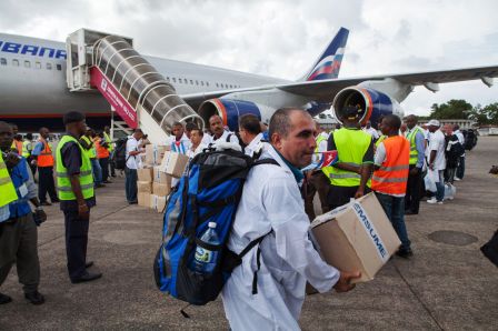 The first members of a team of Cuban doctors and health workers unload boxes of medicines and medical material at the Freetown airport; Sierra Leone; October 2, 2014.
